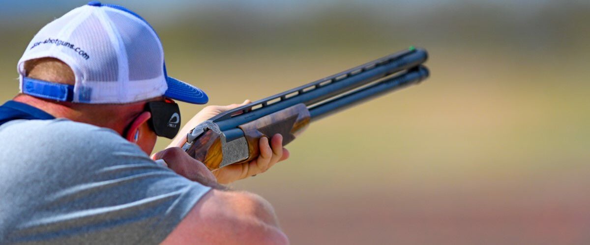 shooter looking down a shotgun