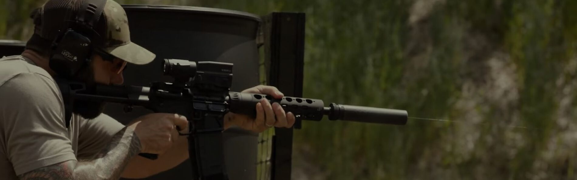 Josh Froelich Shooing a rifle at an outdoor range