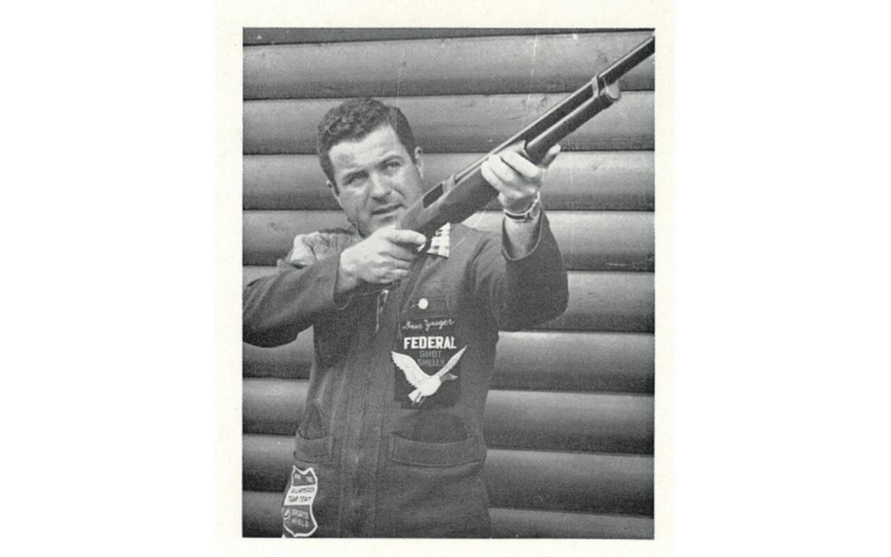 Dave Yeager holding up his shotgun