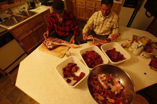 deer meat in bowls on a table