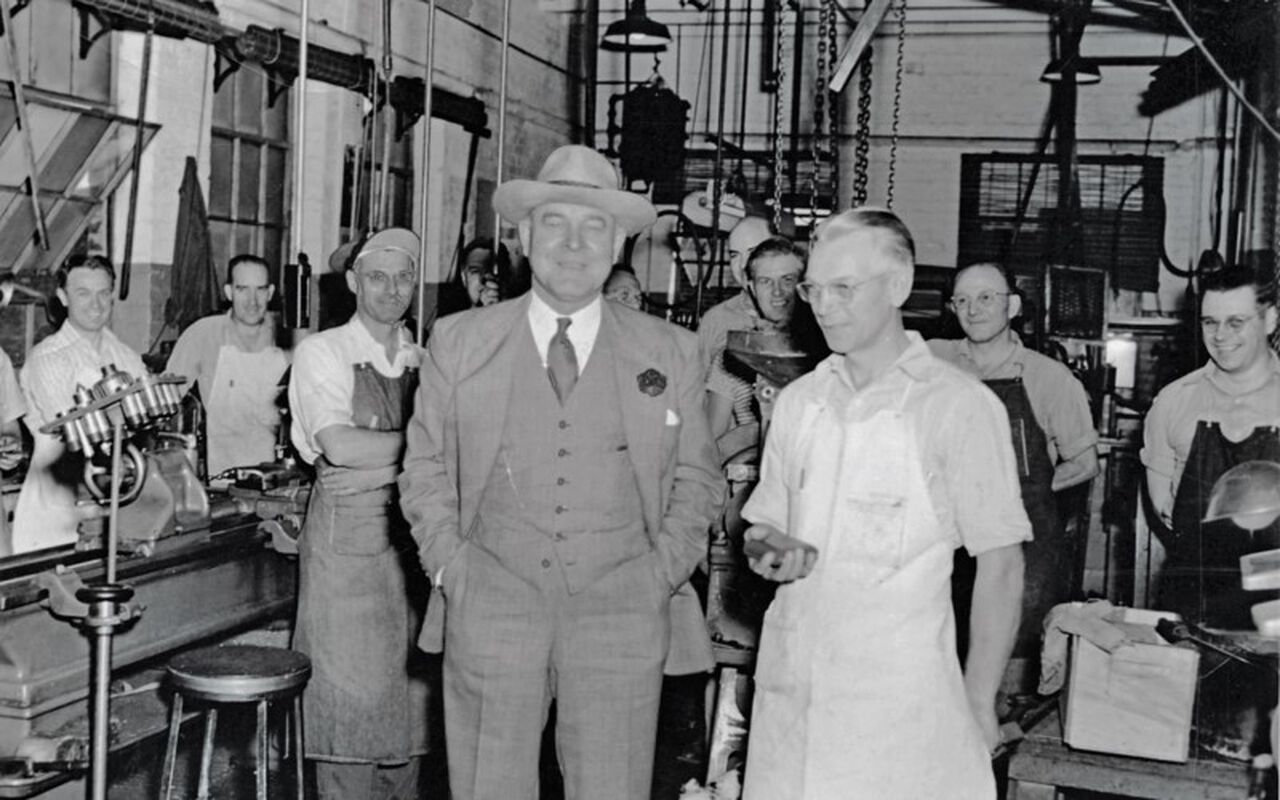 Charles Horn and John Haller standing beside each other in the factory
