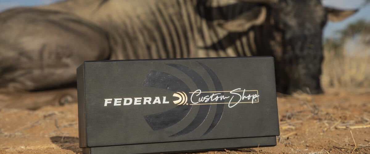 dead wildebeest behind a box of Federal Custom Shop ammunition