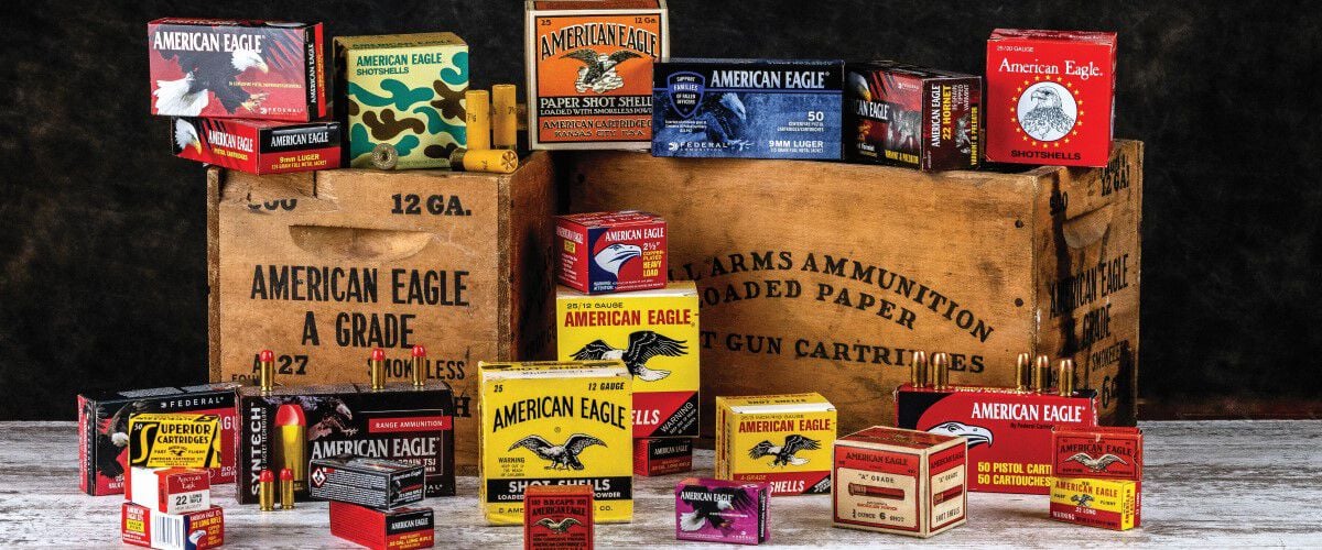 boxes of American Eagle through out the years stacked on wooden boxes and on a table