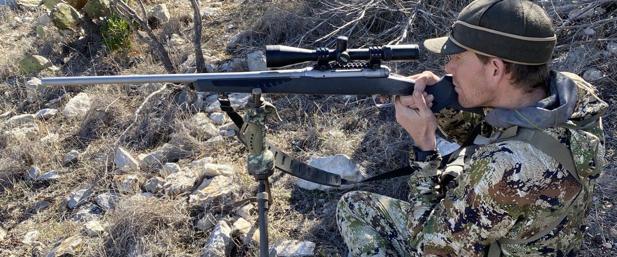 hunter looking down the rifle scope