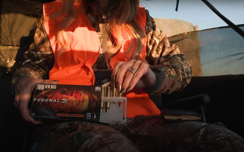 hunter taking Fusion Tipped cartridges out of box