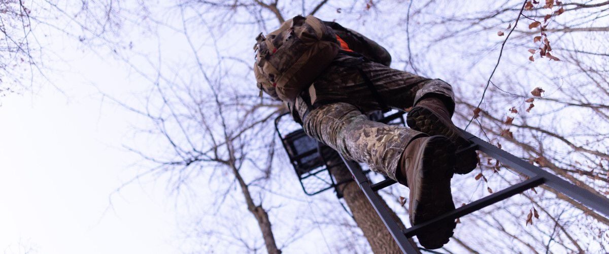 hunter climbin up to a tree blind