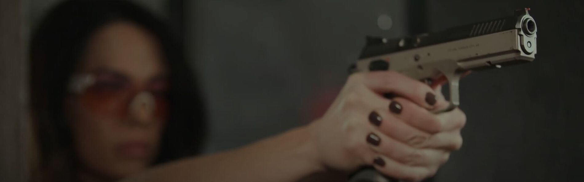 Krystal Dunn holding a pistol