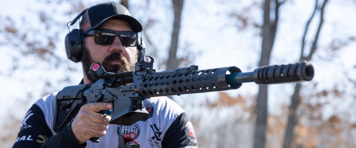 Josh Froleich loading a magazine into a shotgun