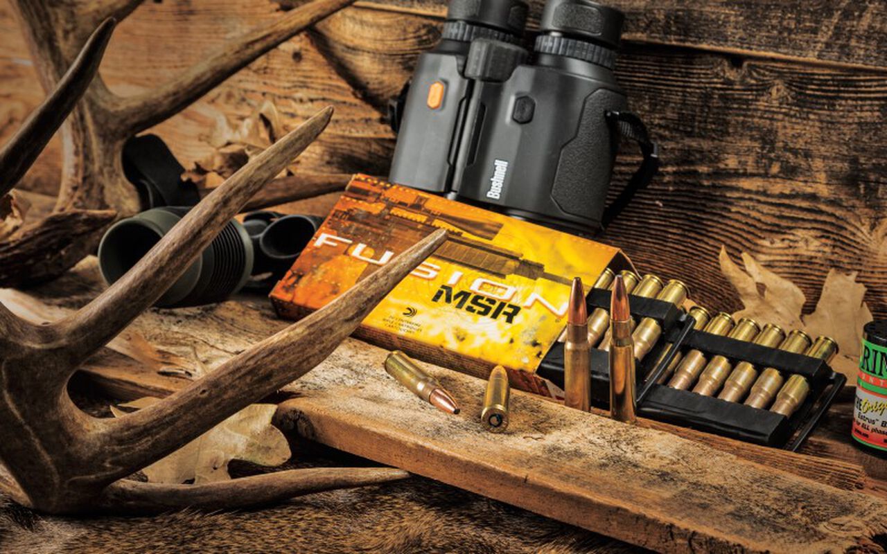 Fusion MSR packaging and cartridges laying beside binoculars and antlers