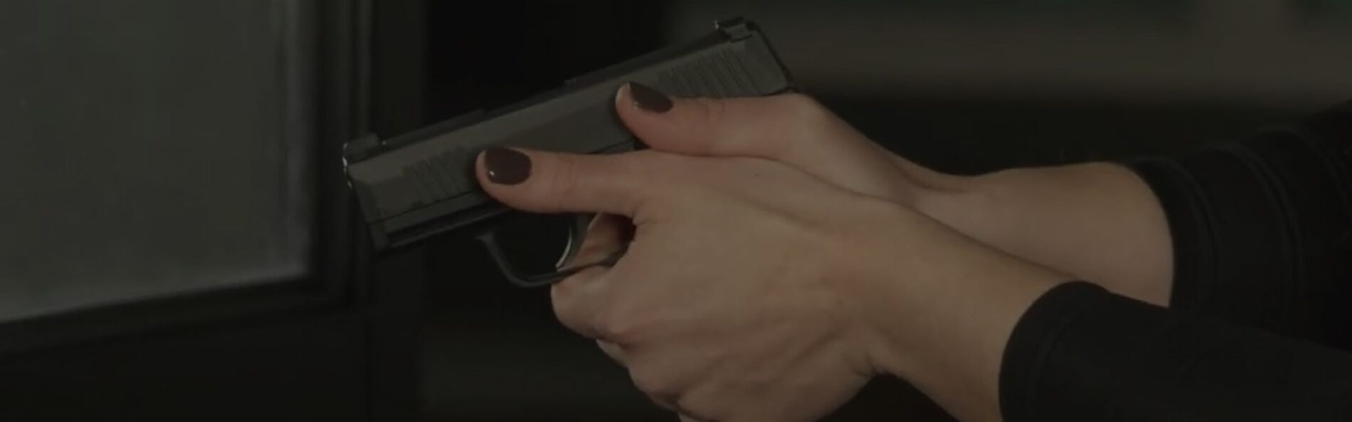 Krystal Dunn showing how to hold a pistol