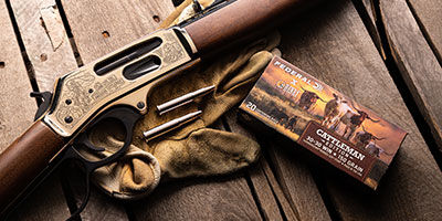 Henry Cattlemon box and lever action rifle