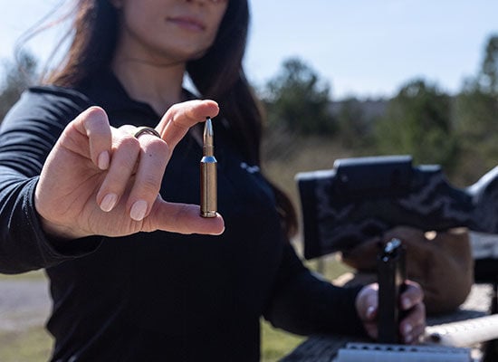 Krystal Dunn holding 65 Creedmoor + Peak