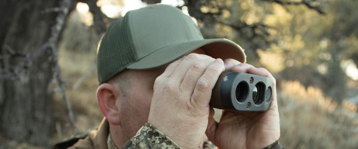 hunter looking through binoculars