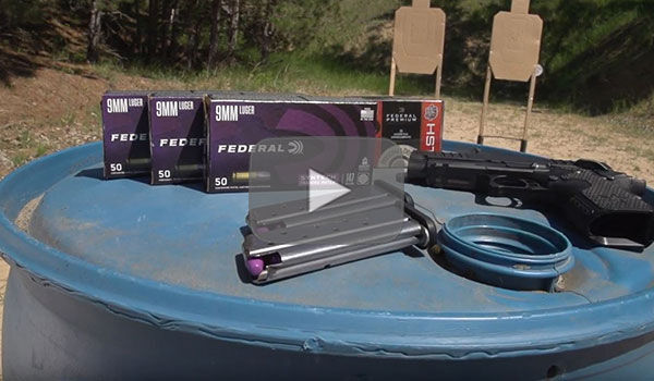 Syntech Training Match and Pistol sitting on a barrel