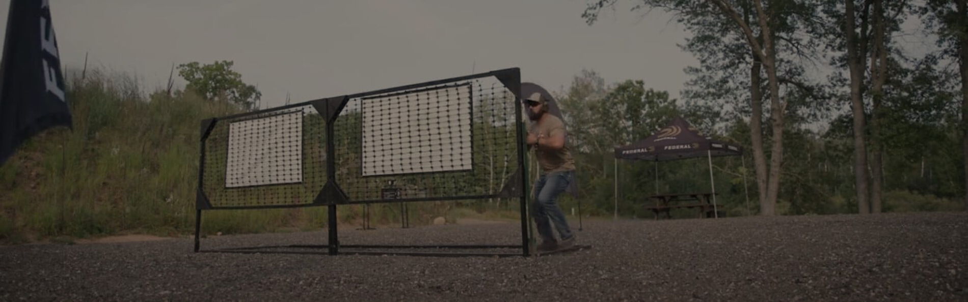 Josh Froelich standing behind an obstacle outside