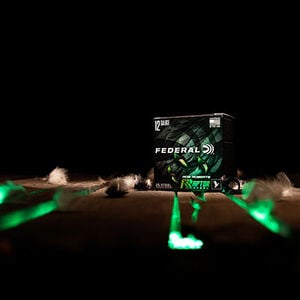 Raptor Steel box sitting on a wood floor with green light coming up from beween the cracks