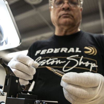 Custom Shop specialist inspecting Custom Rifle ammo